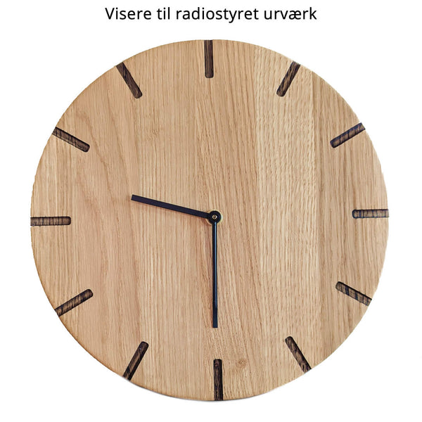 Lohals - wooden wall clock - Light oak with dark carvings