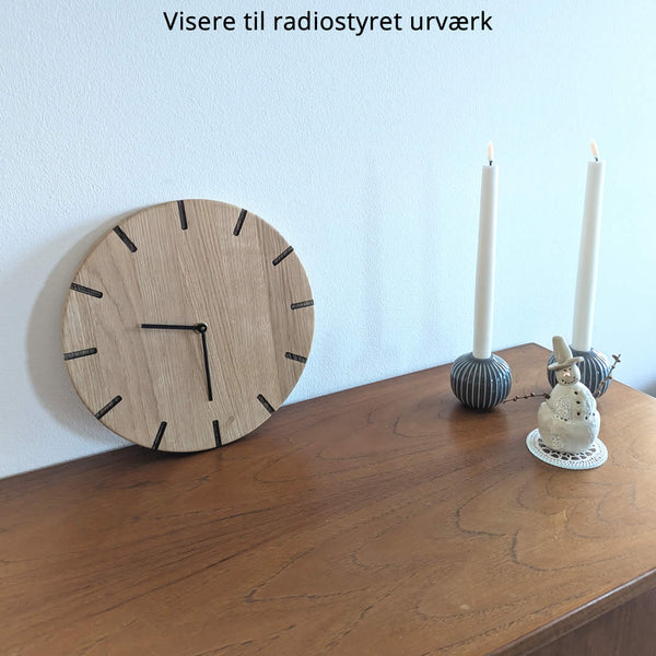 Lohals - wooden wall clock - Light oak with dark carvings